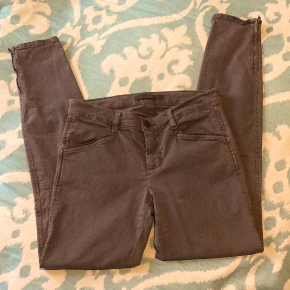 Faded army green skinny jeans with suede accents on legs